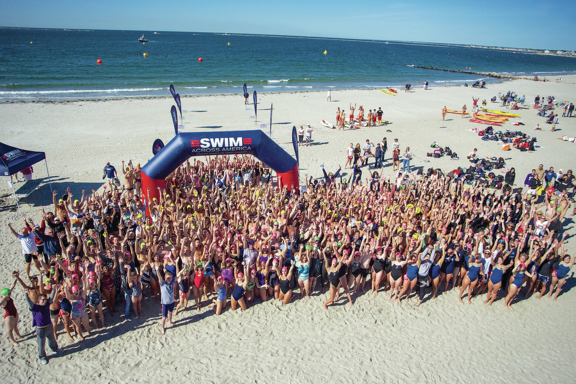 For a Good Cause: Enthusiastic swimmers take to the open water as part of Swim Across America’s annual events nationwide to raise money and awareness for cancer research, prevention and treatment. SAA also holds pool swims year ’round.