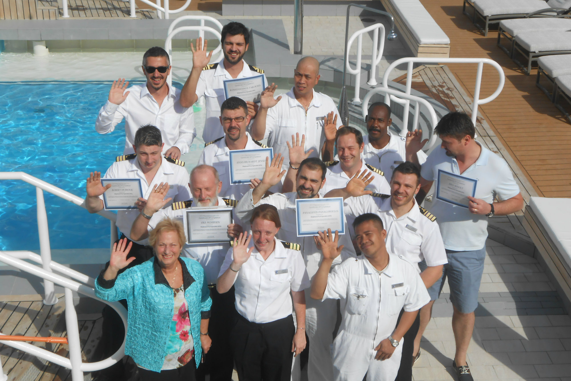 Graduates of a CPO course taught by Connie Sue Centrella (front, far left) gather on the deck of the Azamara Quest in the Greek islands (photo courtesy C.S. Centrella)