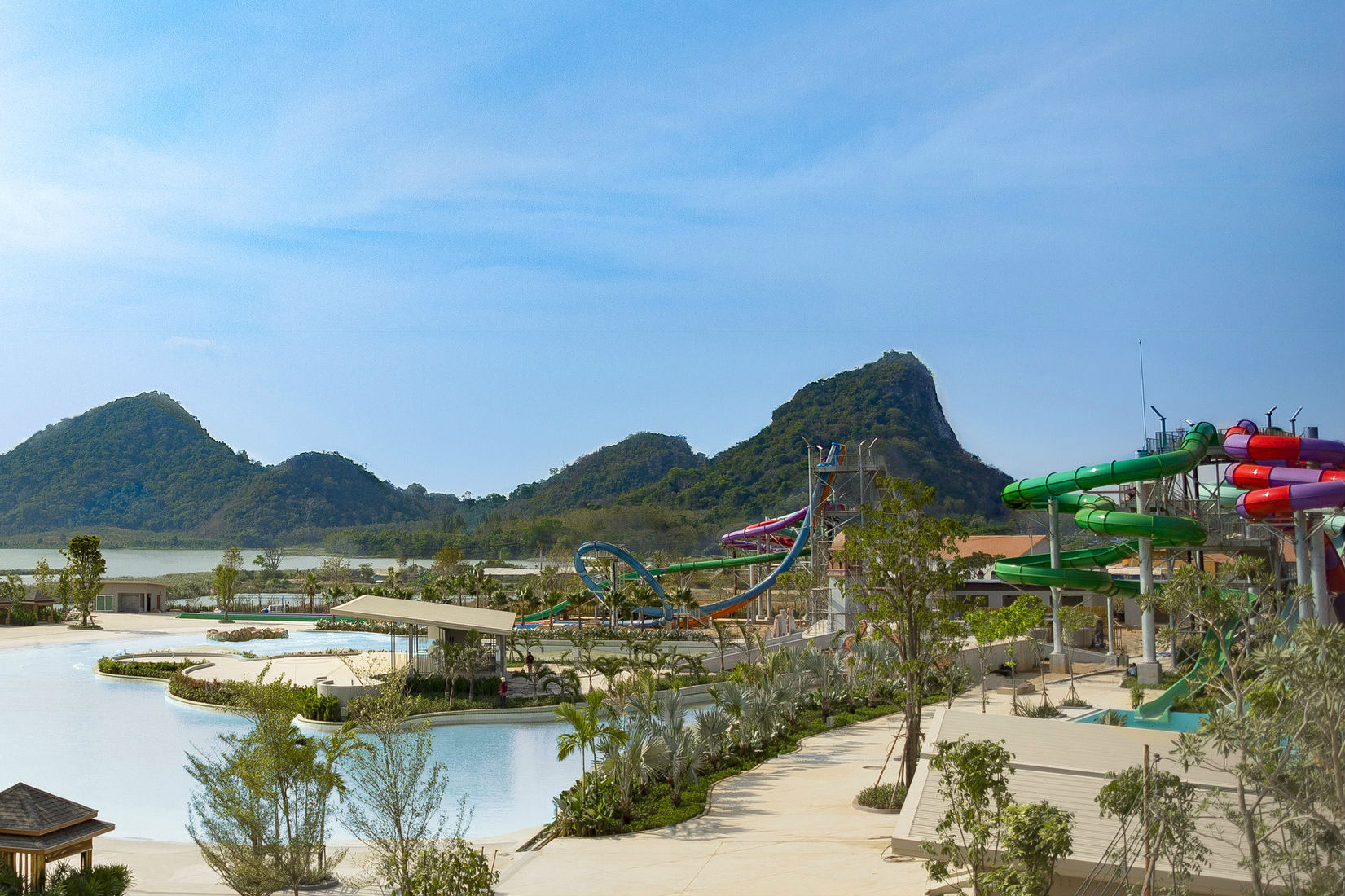 The Double Wave Pool at RamaYana WaterPark in Thailand is divided in half, with stormy waves on one side and gentle rocking waves on the other, all washing up along the "shore," a beach that spans 150 meters. Nestled between the two wave sections is the entertainment stage.