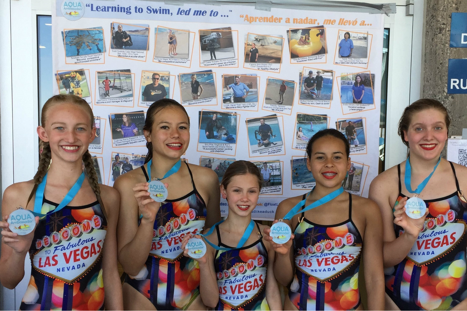 Following their special performance at the Float Like A Duck event, the Southern Nevada Desert Mermaids Synchronized Competitive Swimming Team show off their Aqua Ambassador Medals, which they received for participating in the PSA video.