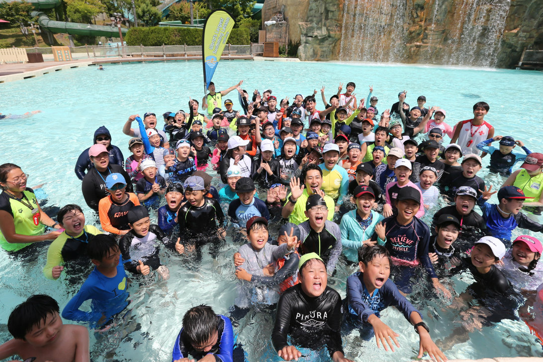 Children celebrate the World's Largest Swimming Lesson at Carribean Bay at the Everland Resort in South Korea.