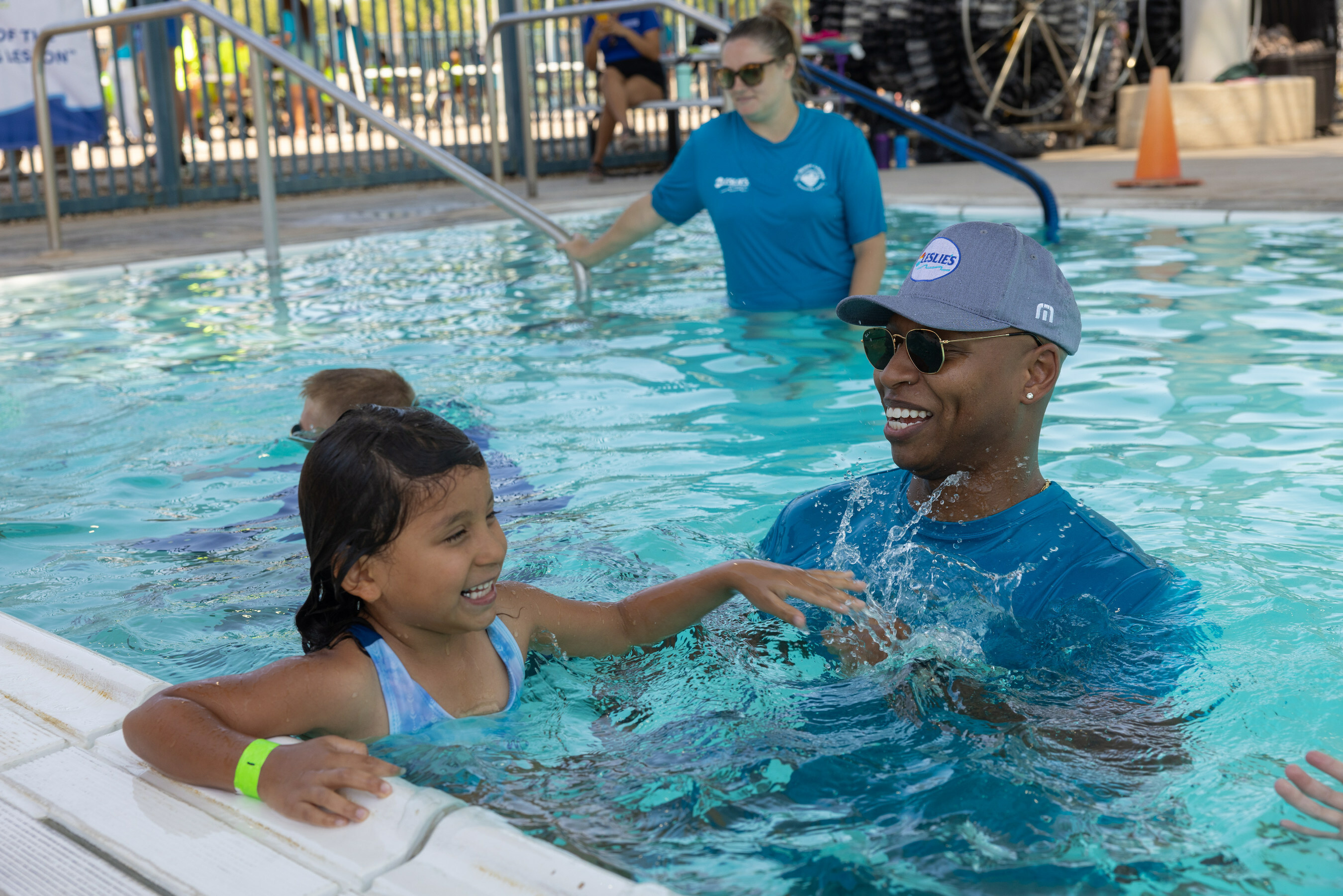 U.S. Olympic Gold Medalist, Cullen Jones, helps students learn water safety skills at the Valley of The Sun YMCA/Leslie's World's Largest Swimming Lesson event in Phoenix, AZ. Jones shared his personal water safety/learn to swim story to help raise awareness about the importance of learning to swim and using layers of protection including adult supervision and preventing access to water with fencing and pool covers.