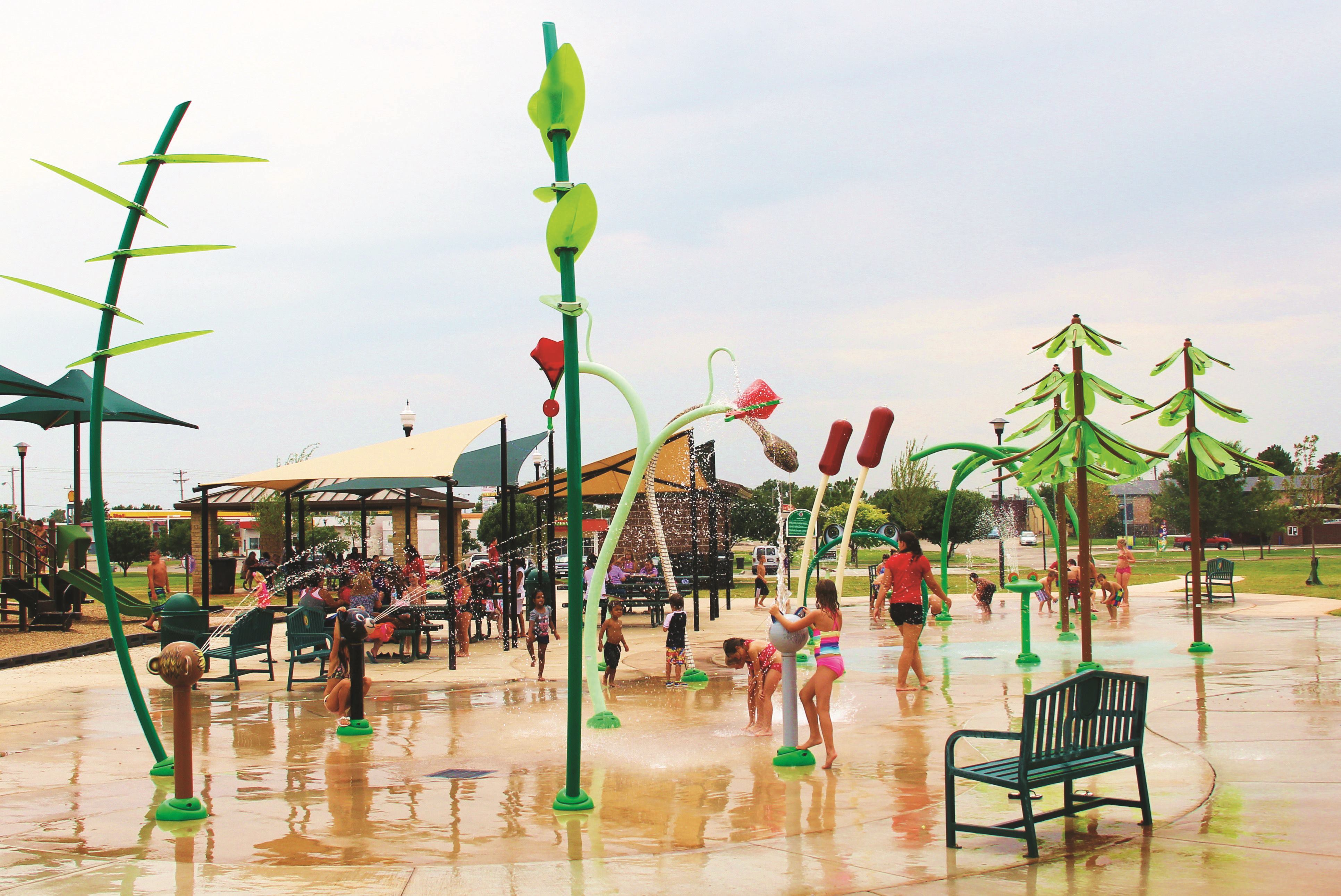 At the center of the 4,500-square-foot splashpad is the “Family Bay,” featuring a bullfrog spray loop, frog and custom rattlesnake that shoots streams of water. These introduce infants and preschoolers to larger water elements through interactive features that allow touching, rotating and moving. The “Action Bay,” targeted toward teens and tweens, is designed to promote social development skills through activities that are high-energy, intensive and collaborative. This area features an interactive wolf, mountain lion and bear water cannons, several cause-and-effect ground sprays and dumping flowers.