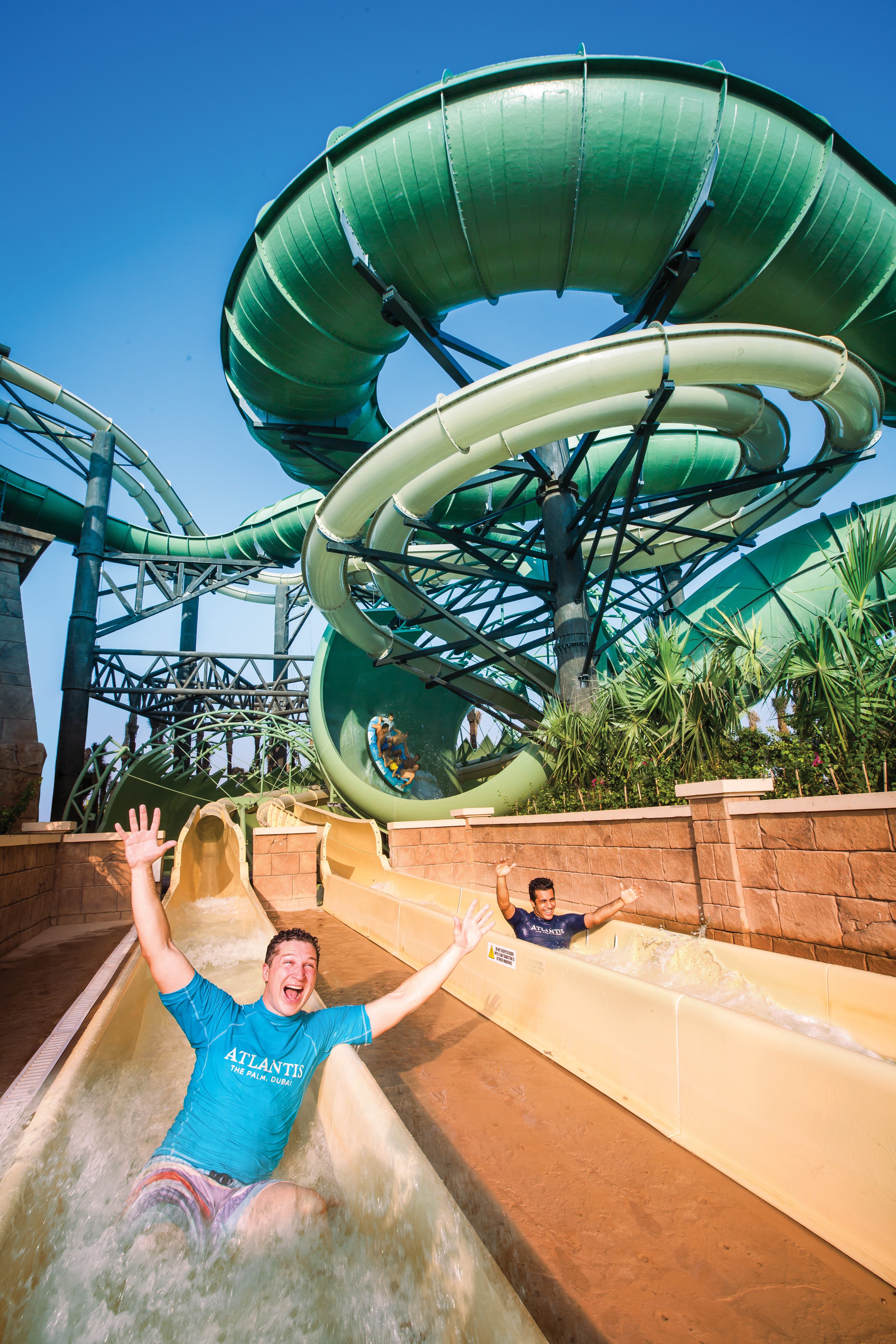 For this project, the design team was working with an already existing lush tropical aesthetic. In keeping with that theme, the Tower of Poseidon resembles an Atlantean pyramid surrounded by jungle. Natural tones, even on the fiberglass features, were used to blend with the sandy desert background. Features were placed to be hidden among the greenery, and special effects such as fire, water, fog and light were used as well. The project also features water escalators and a transportainment system.