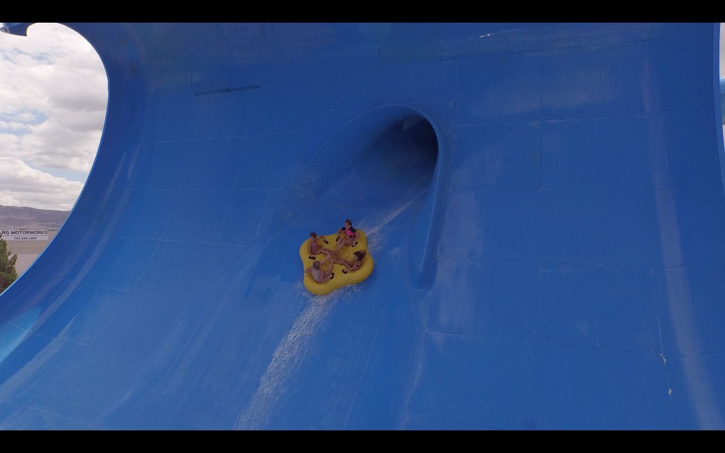 The giant slide's path runs nearly 195 feet and is made from 31 tons of fiberglass. It features a 40-degree sloped entrance and a unique, parabolic design. The ride begins with a rushing trip through the dark, followed by a drop down 55 feet through an enclosed flume before entering the swell of a mammoth wave to catch some "hang time." Twisting and turning, passengers continue along the ride's path, speeding through numerous unexpected changes in momentum before shooting through the wave's crest. Finally, they they slide from side to side, forwards and backwards, before splashing into the exit.