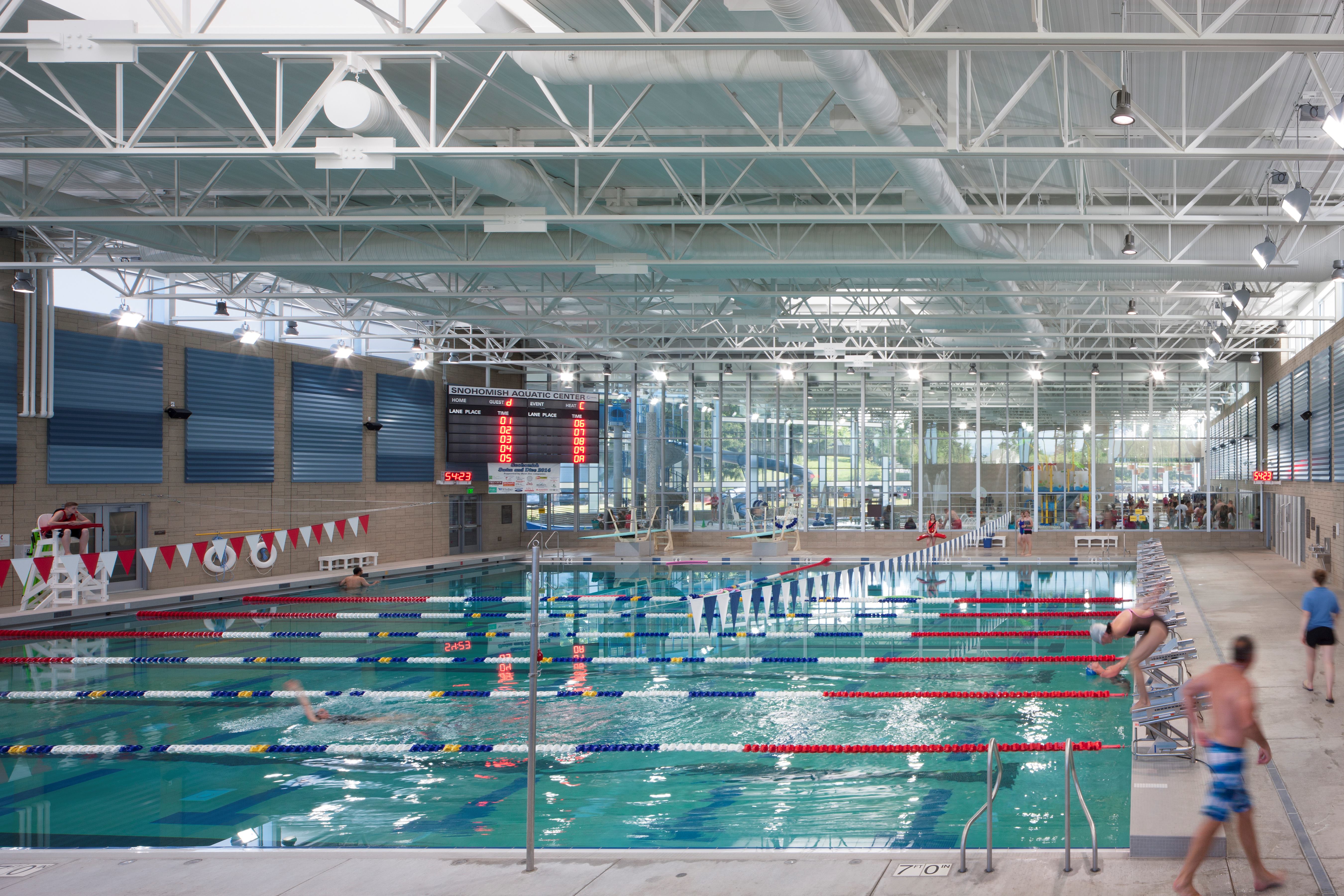 The city and local school district partnered in building the center. A competitive pool accommodates training and events for the two high schools and seats more than 400 spectators. A glass wall separates it from the leisure pool so the areas can operate independently of each other while remaining visually connected.