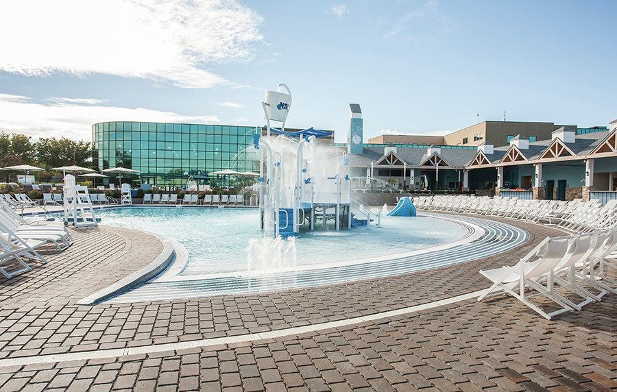 Style was taken into serious consideration. The colors were chosen to complement the NAC club logo. More importantly, the owners and designers chose the theme of an oceanside beach resort, so members could stay at the club and feel transported to the Jersey Shore or Atlantic City. The brick pavers, white and light blue colors, and hammock-style deck chairs offer that seaside feel.
