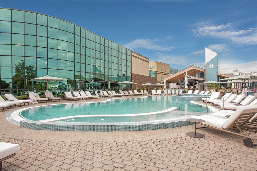 Say the designers: “The NAC Outdoor Resort Complex is a fulfillment of the owner’s dream to have an all-encompassing outdoor aquatic facility to enhance the club experience for their members. The pool area itself is extensive even by private-club standards, offering way more than the typical lap pool or play pool.”