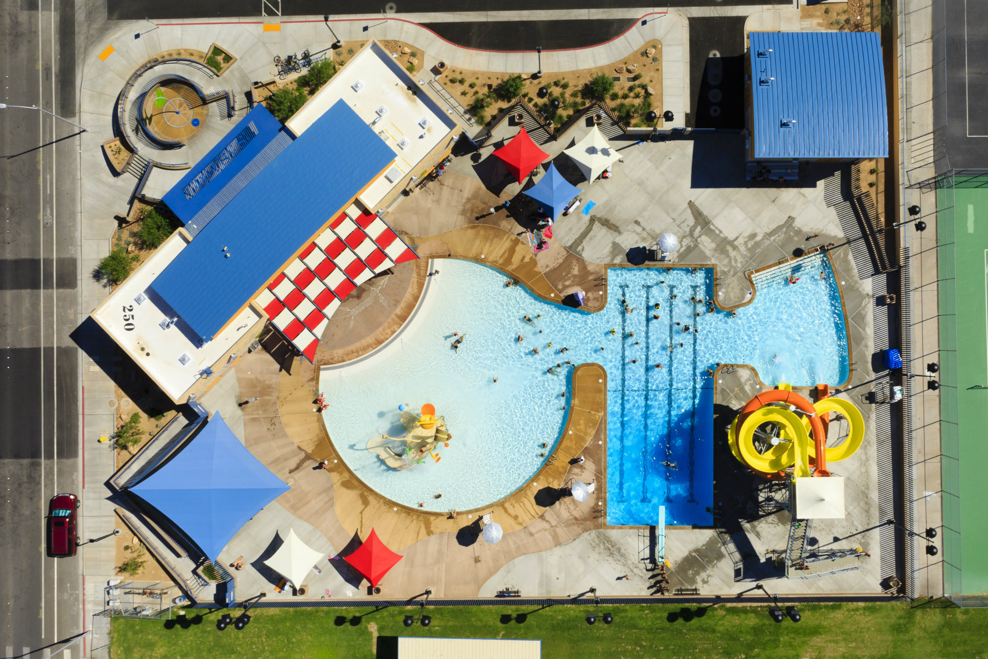 Old is new again: This facility, originally built in the 1950s, needed an upgrade so it could not only function but also appeal to the diverse and evolving needs of the community. In place of the single pool, the design team created three distinct yet interconnected areas in the 7,450-square-foot property. Included are a four-lane lap pool, recreation pool with an open slide and play structure, and a splash pool with two tube slides. An interactive waterfeature at the aquatics center’s entrance engages children while they wait to go in. To accomplish this in a limited space, and provide an easy flow through the aquatics features, the designers connected the three vessels.(