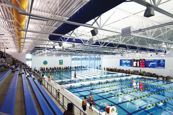 This 10-lane-by-50-meter competition pool holds nearly 600 spectators and hundreds of participants. The double bulkhead configuration offers maximum flexibility; the venue can accommodate events large and small, as well as classes and open swimming simultaneously. Except during

long course events, one side of the pool can be set up for competitions while facility members can still swim at the other end. The RecPlex Aqua Arena pool also features a shallow middle,providing for competitive start depths of 2 meters or greater, and deep underwater kicking at both ends.  A 12-foot depth at the

pool’s east end provides the option to add diving boards in the future.