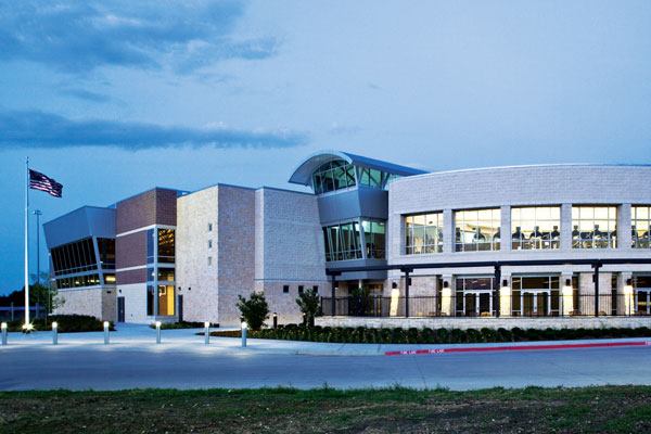 Plans for the facility were

born from a need for family recreation/aquatic center that

accommodated the general population. Aesthetically, the premise

behind the design was to make visual connections between various

spaces, from outside and inside. Inside the lobby, one can observe

almost every main activity taking place throughout the building.

From the outside, a key attribute is a dynamic exterior façade

with vistas of the aquatic, fitness and jogging track components

through the large glass windows. Where possible, the design also

highlights the use of “classic Texas materials,” such

as limestone for walls and piers; corrugated galvanized

“silver” metal roofing and siding; and heavy timber

construction.