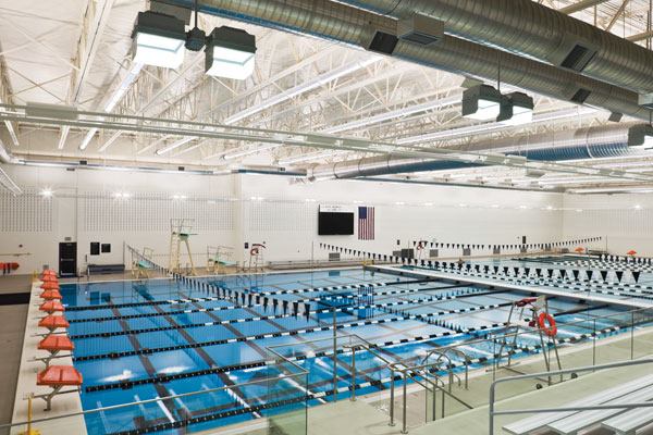 The aquatic center design focuses on the safety and comfort of swimmers and spectators. To control sound, acoustical metal roof deck and masonry units were used in the pool area. Insulated precast concrete wall panels were used to create an energy-efficient building envelope. For the pool

itself, high efficiency filtration and an ultraviolet light system save energy and enhance the water and air quality. Mechanical systems with state-of the-art temperature and humidity controls provide six air changes per hour for the comfort of the swimmers.