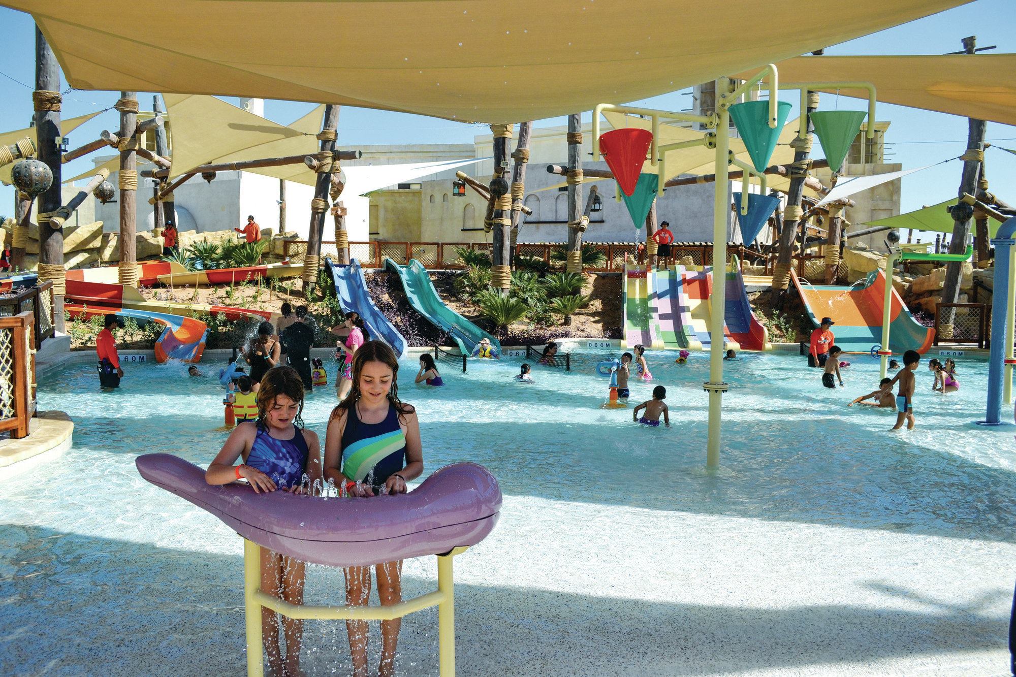 Every detail in the park is meant to honor the heritage of the UAE's Emirati people. In deference to the Abu Dhabi climate, the designers created several permanently shaded rides, queues, lounging and dining areas. A careful use of fun colors incorporates youth appeal while fitting into the Emirati theme, as seen on the low-profile slides and accents here at Tot’s Playground. It is one of 15 attractions suitable for smaller children.