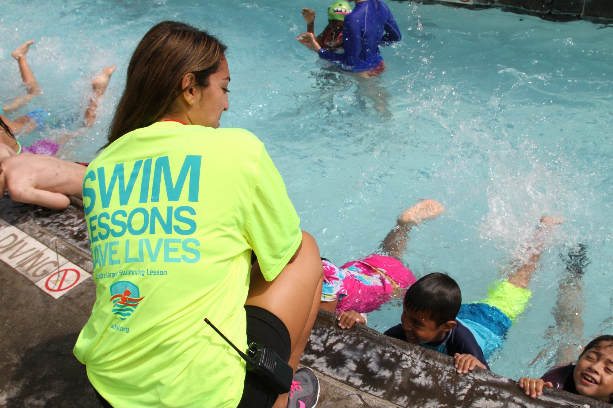 Supervising lifeguard Nicole Alvarado instructs swimmers during the 2016 WLSL at Splash! La Mirada, near Los Angeles.